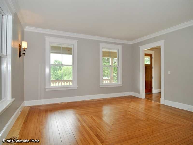 This is an example of a medium sized classic living room in Providence with grey walls and medium hardwood flooring.