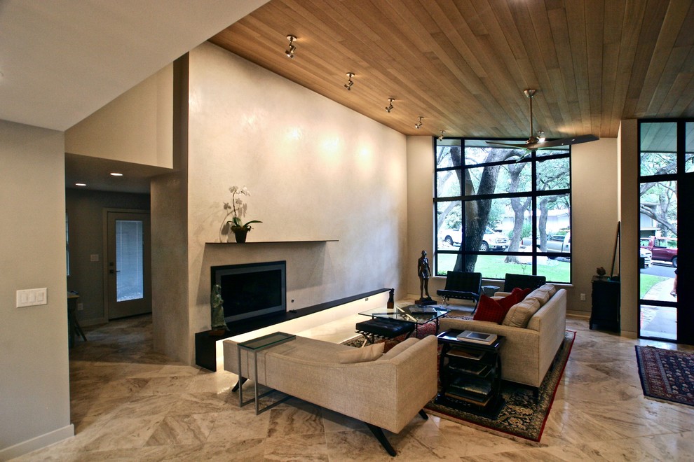 オースティンにある高級な広いトランジショナルスタイルのおしゃれなLDK (白い壁、漆喰の暖炉まわり、マルチカラーの床) の写真