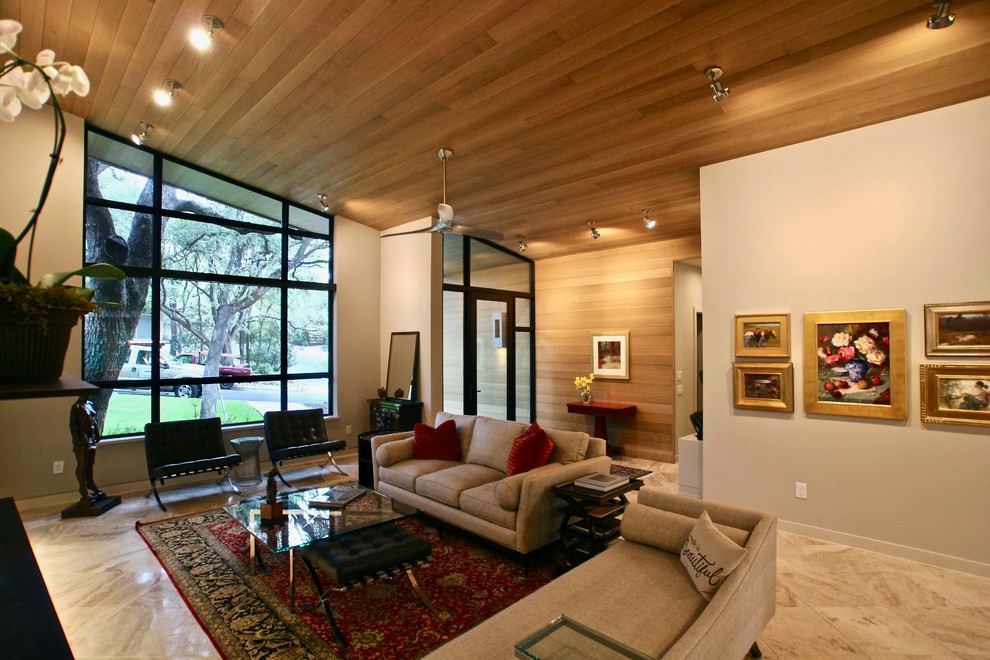 Immagine di un grande soggiorno classico aperto con pareti bianche, cornice del camino in intonaco e pavimento multicolore