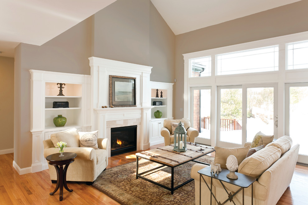 Example of a large classic living room design in Boston with a standard fireplace