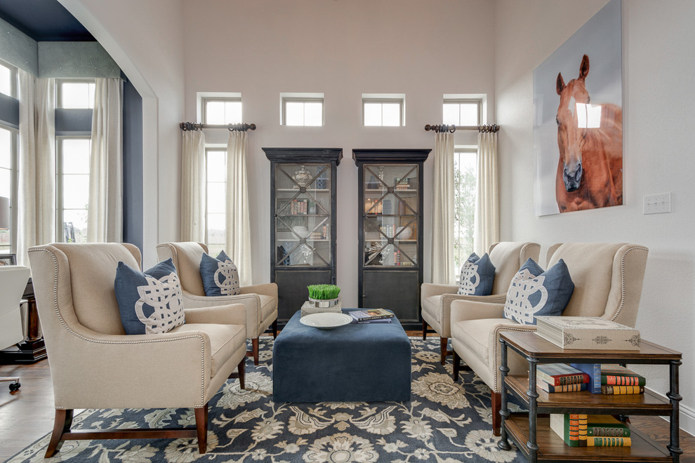 Example of a classic open concept dark wood floor living room library design in Dallas with white walls, no fireplace and no tv