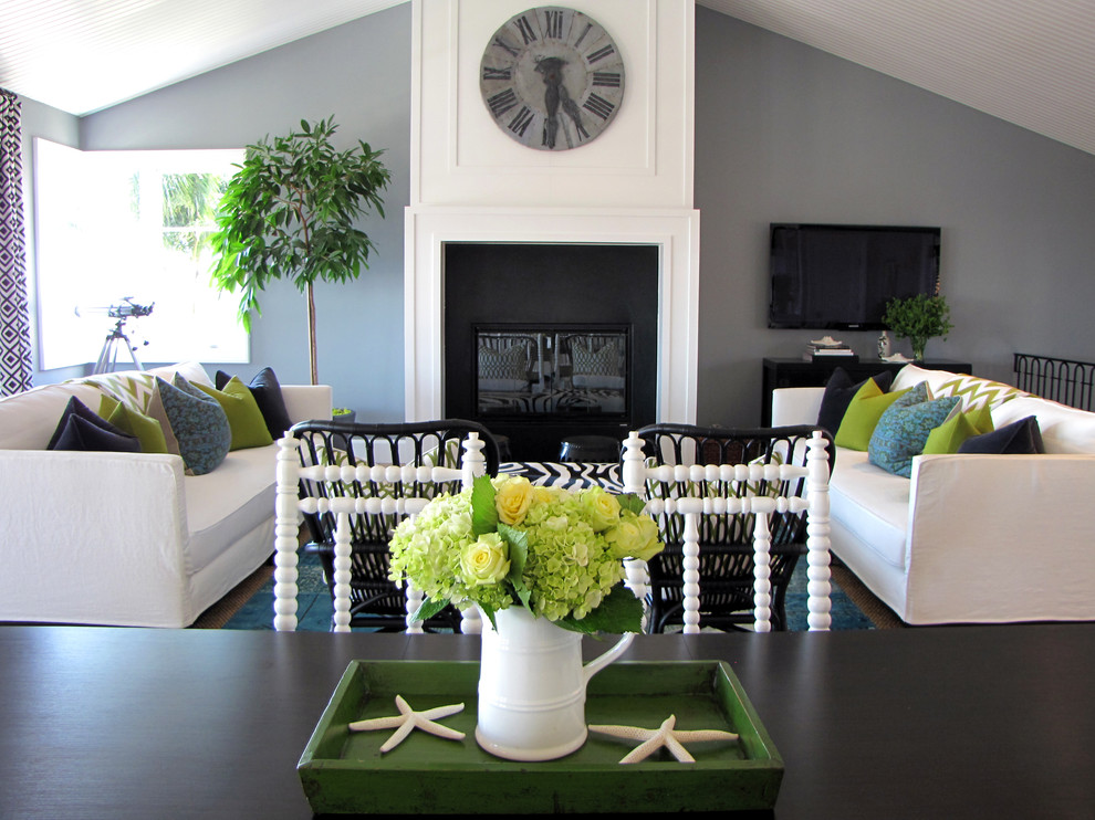 Beach style living room photo in Orange County with gray walls