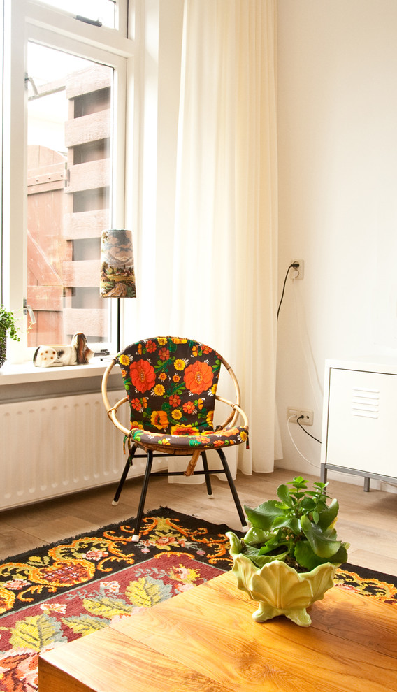 This is an example of a bohemian living room curtain in Amsterdam with white walls.
