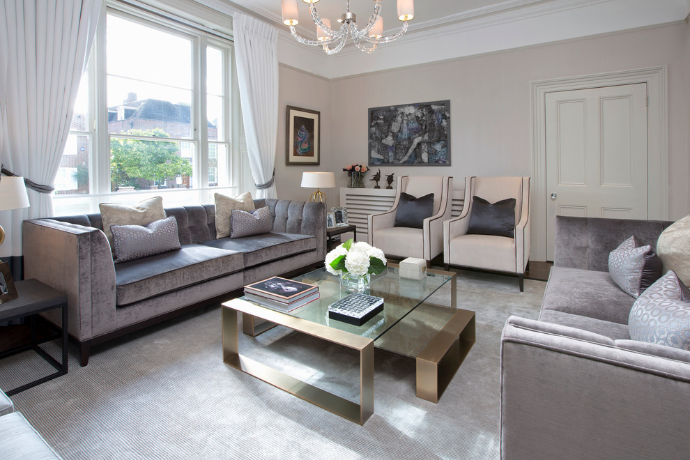 Contemporary grey and cream enclosed living room in London with feature lighting.