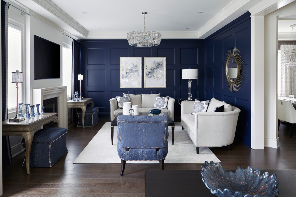 Inspiration för ett mellanstort vintage separat vardagsrum, med blå väggar, en standard öppen spis, en väggmonterad TV, mörkt trägolv och brunt golv