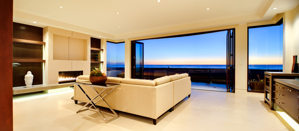 Example of a mid-sized beach style formal and open concept porcelain tile and beige floor living room design in Los Angeles with beige walls, a ribbon fireplace, a plaster fireplace and no tv