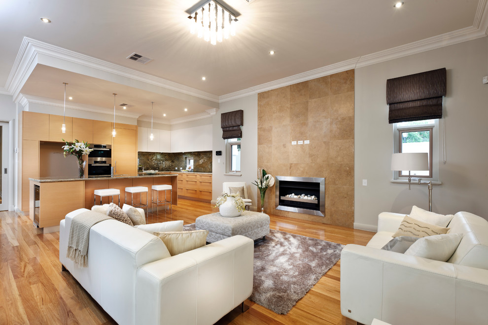 Contemporary open plan living room in Perth with grey walls, medium hardwood flooring, a ribbon fireplace and a tiled fireplace surround.