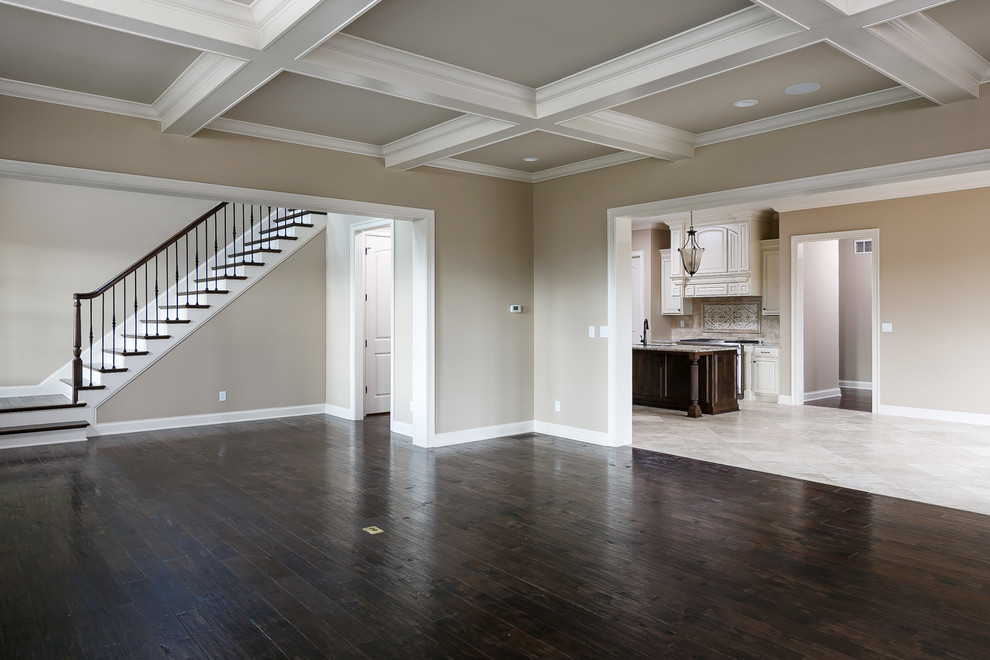 Classic open plan living room in Louisville with dark hardwood flooring.
