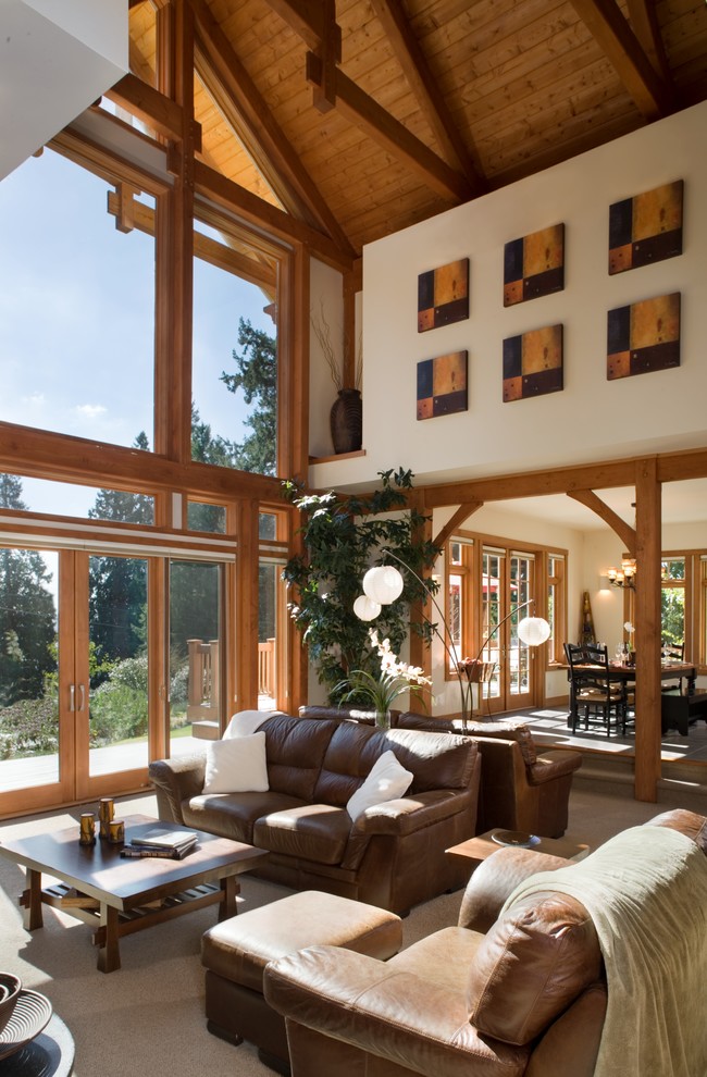 Example of a mountain style formal and open concept slate floor living room design in Seattle with white walls, a standard fireplace, a stone fireplace and no tv