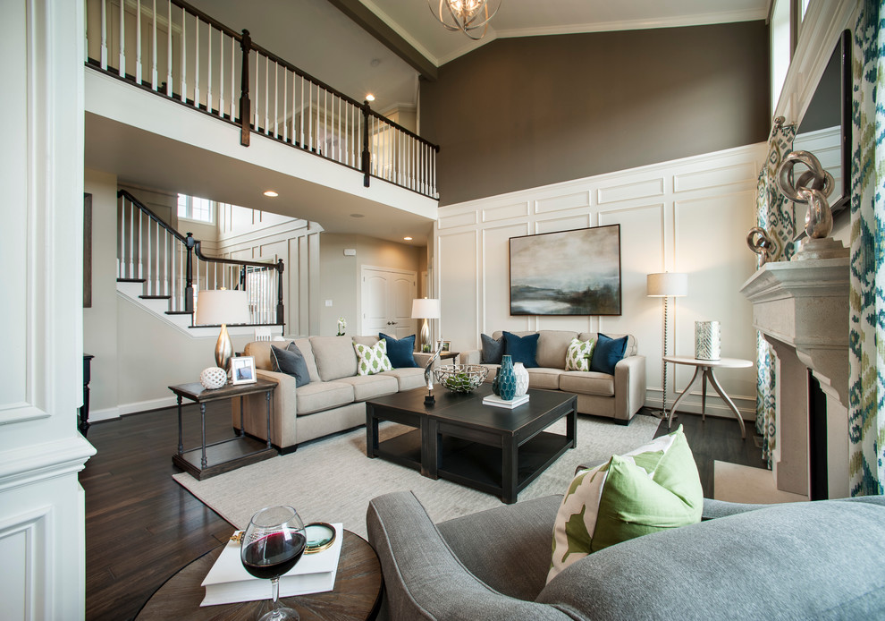 Photo of a large traditional grey and brown open plan living room in Philadelphia with brown walls, a standard fireplace, a wall mounted tv, dark hardwood flooring and feature lighting.