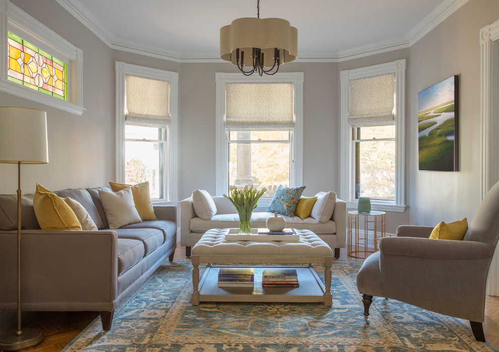 Inspiration for a traditional formal living room in Boston with grey walls and light hardwood flooring.