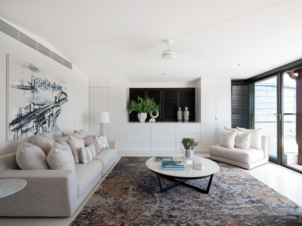 Design ideas for a contemporary living room in Sydney with white walls and white floors.