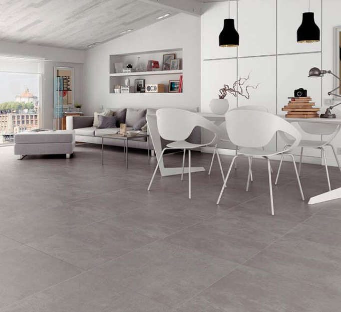 Esempio di un soggiorno minimal di medie dimensioni e aperto con pavimento in gres porcellanato e pavimento grigio
