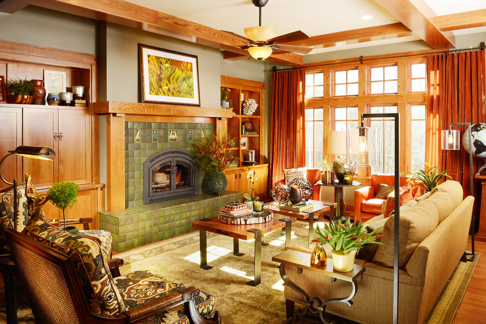 Example of a large arts and crafts open concept light wood floor living room design in Other with a standard fireplace, a tile fireplace, no tv and green walls