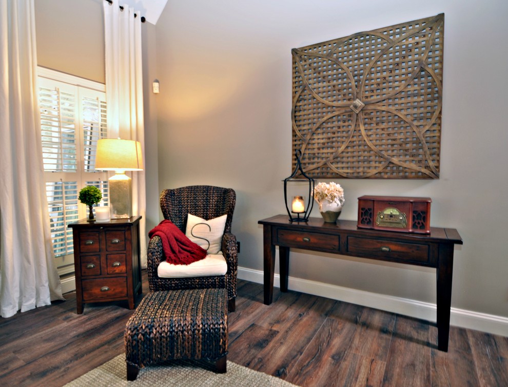 Rustic living room in Atlanta with beige walls and laminate floors.