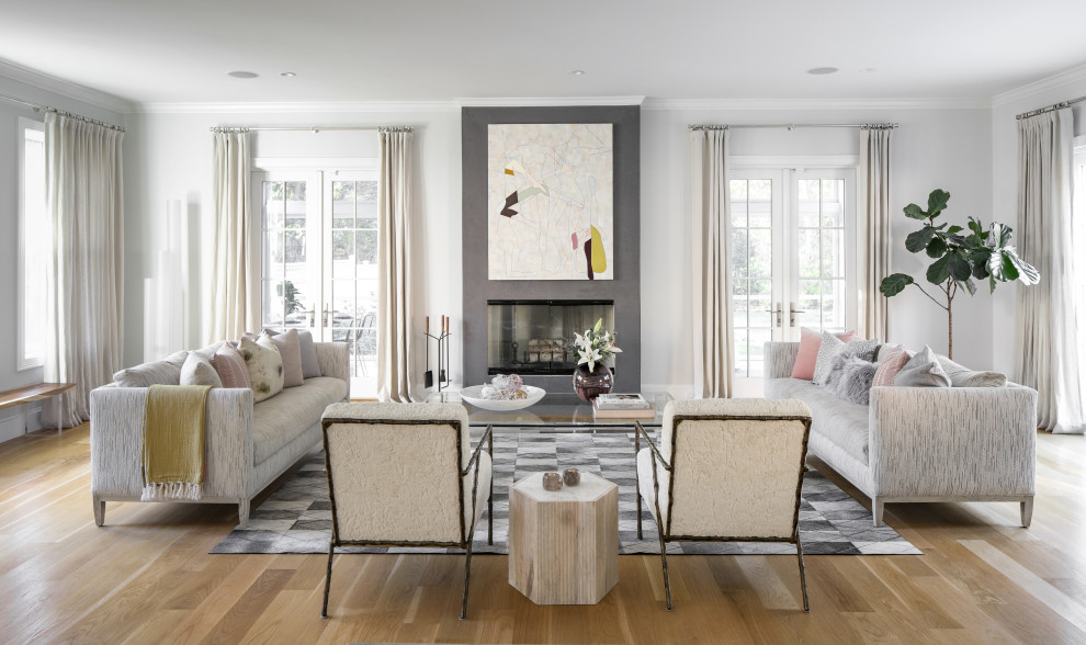 Mid-sized transitional formal and open concept medium tone wood floor and brown floor living room photo in New York with gray walls, a standard fireplace, no tv and a concrete fireplace
