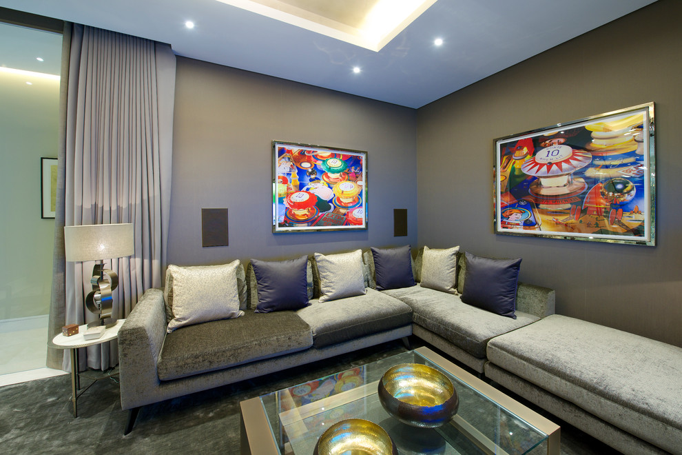 Example of a mid-sized trendy enclosed carpeted, gray floor, coffered ceiling and wallpaper living room design in London with gray walls and a wall-mounted tv
