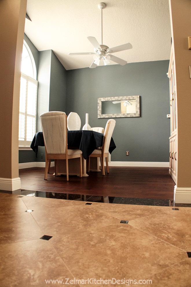 Large elegant open concept dark wood floor living room photo in Orlando