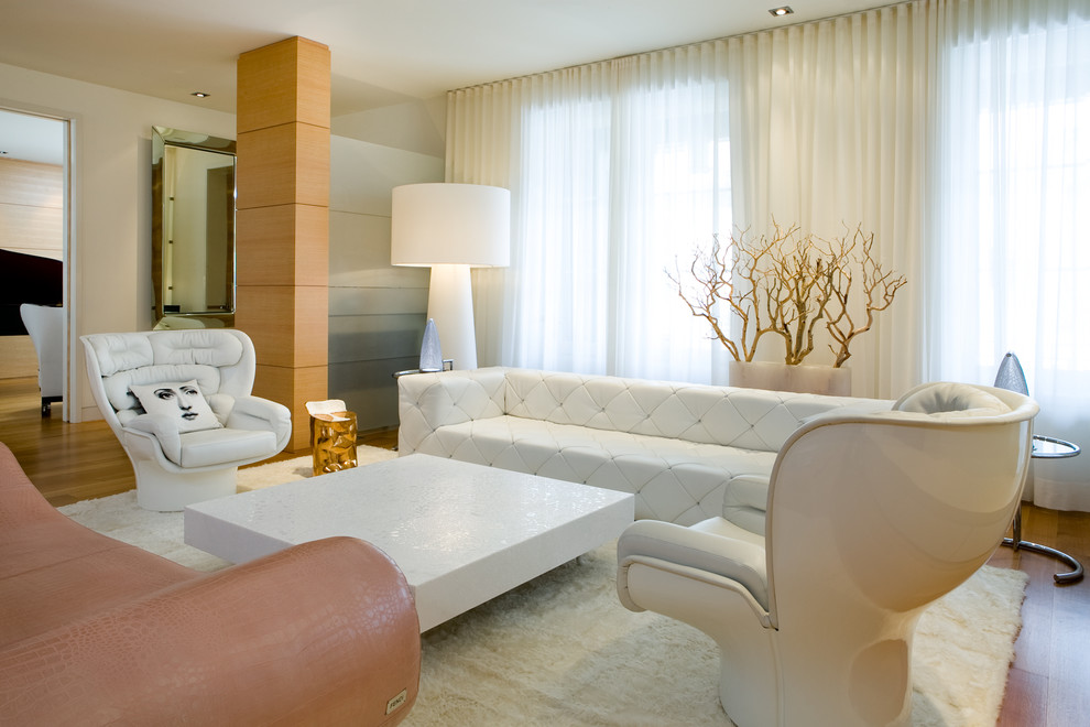 Пример оригинального дизайна: большая парадная, изолированная гостиная комната:: освещение в современном стиле с белыми стенами, паркетным полом среднего тона, стандартным камином, фасадом камина из камня и коричневым полом без телевизора