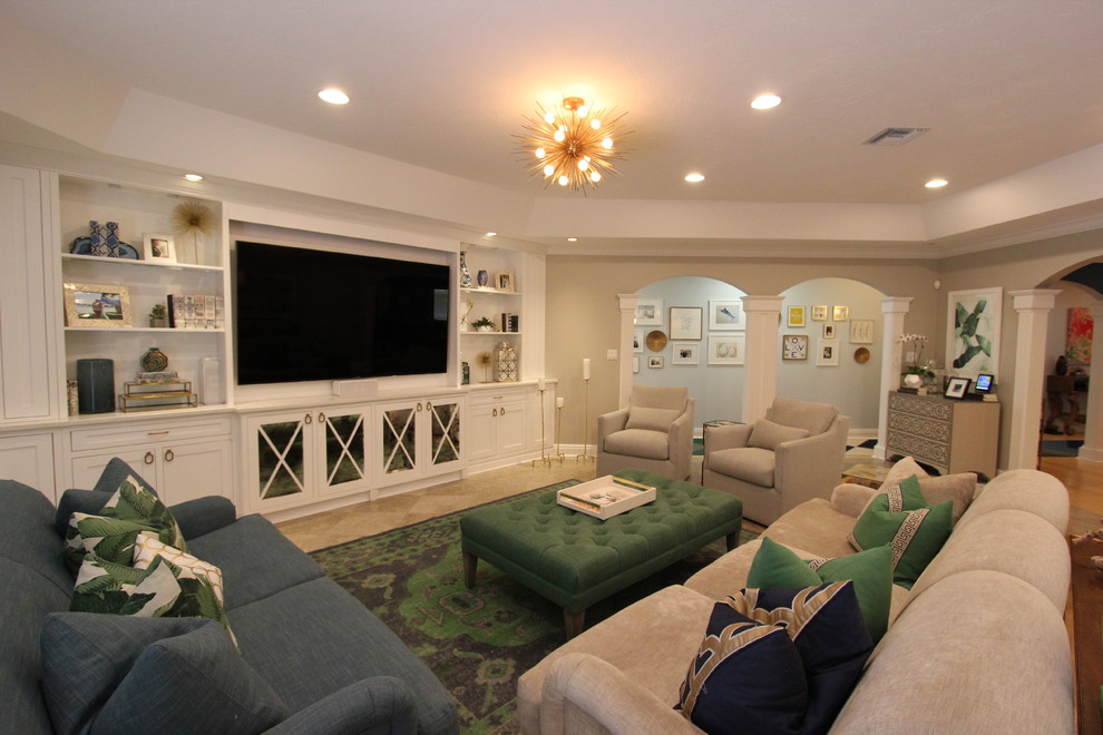 Expansive classic open plan living room in Tampa with a reading nook, beige walls, travertine flooring, no fireplace and a built-in media unit.