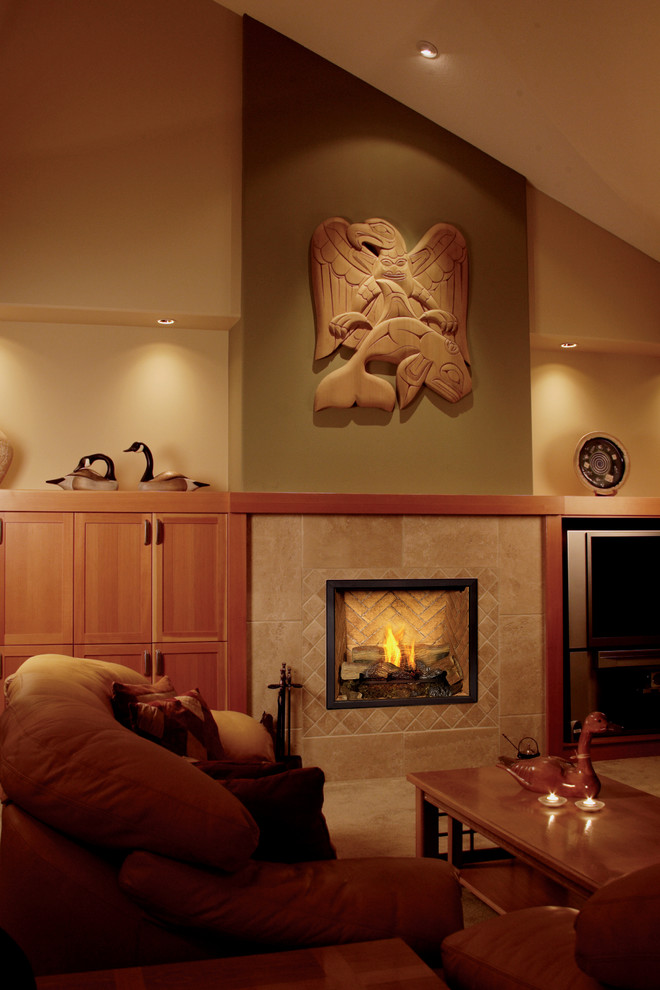 This is an example of a traditional living room in Denver with multi-coloured walls, carpet, a standard fireplace and a tiled fireplace surround.