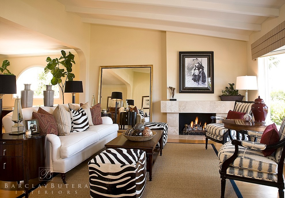 Example of a transitional formal and open concept light wood floor living room design in Orange County with beige walls, a standard fireplace and a stone fireplace