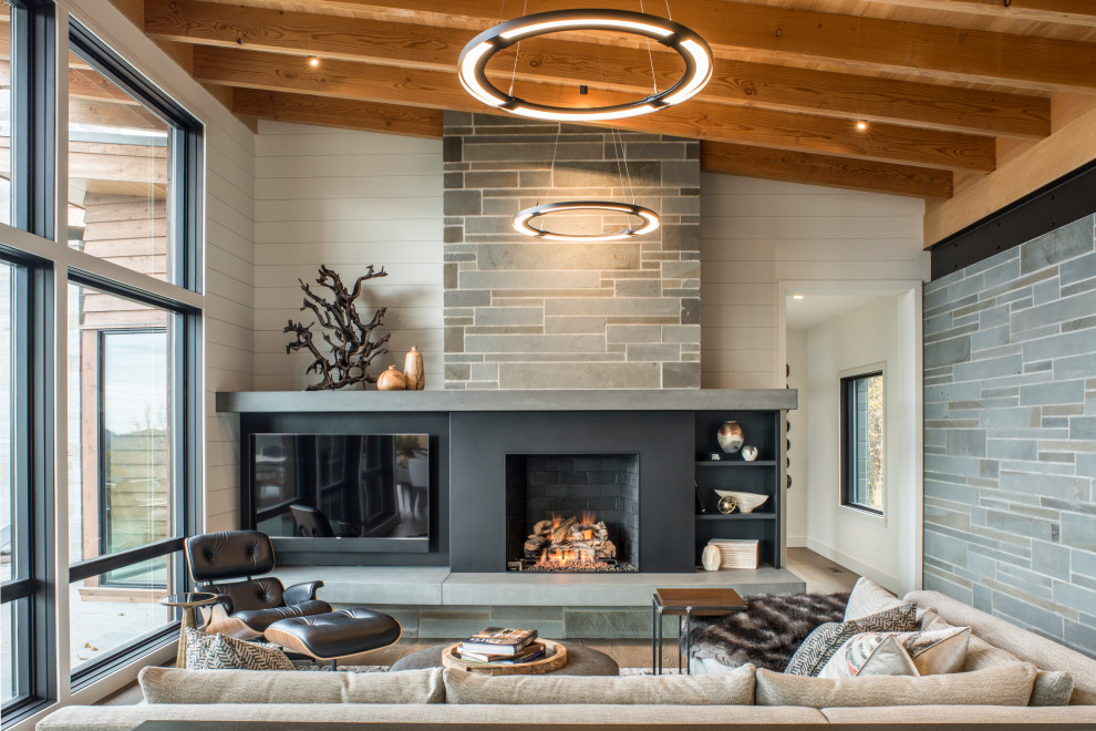 Inspiration for a medium sized modern open plan living room in Other with white walls, medium hardwood flooring, a standard fireplace, a metal fireplace surround, a built-in media unit and brown floors.