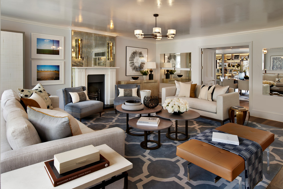 Идея дизайна: парадная, изолированная гостиная комната в стиле неоклассика (современная классика) с серыми стенами, стандартным камином и ковром на полу без телевизора