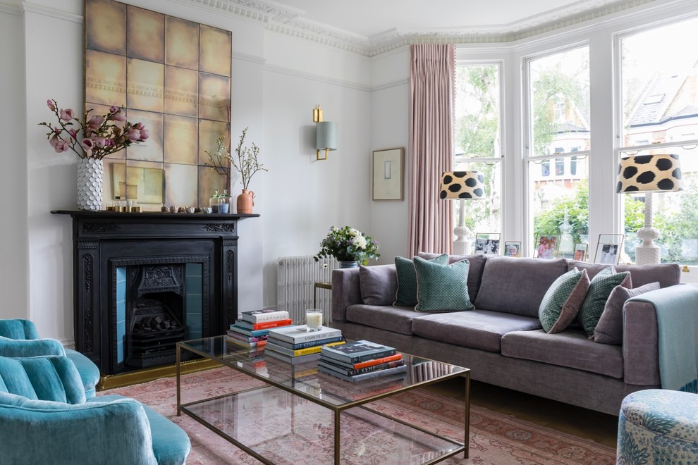 Photo of a classic living room in London with white walls and a standard fireplace.
