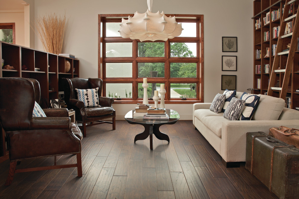 Mid-sized elegant enclosed dark wood floor living room library photo in Jacksonville with beige walls and no tv