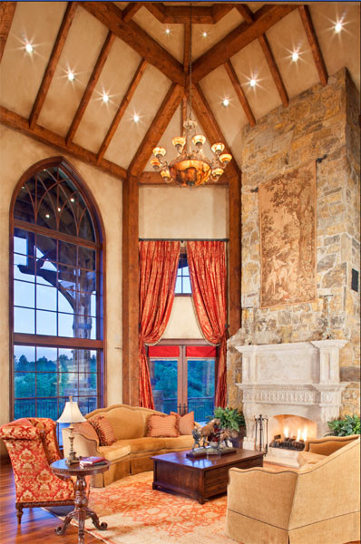 Idées déco pour un très grand salon classique ouvert avec une salle de réception, un sol en bois brun, une cheminée standard, un manteau de cheminée en pierre et un mur beige.