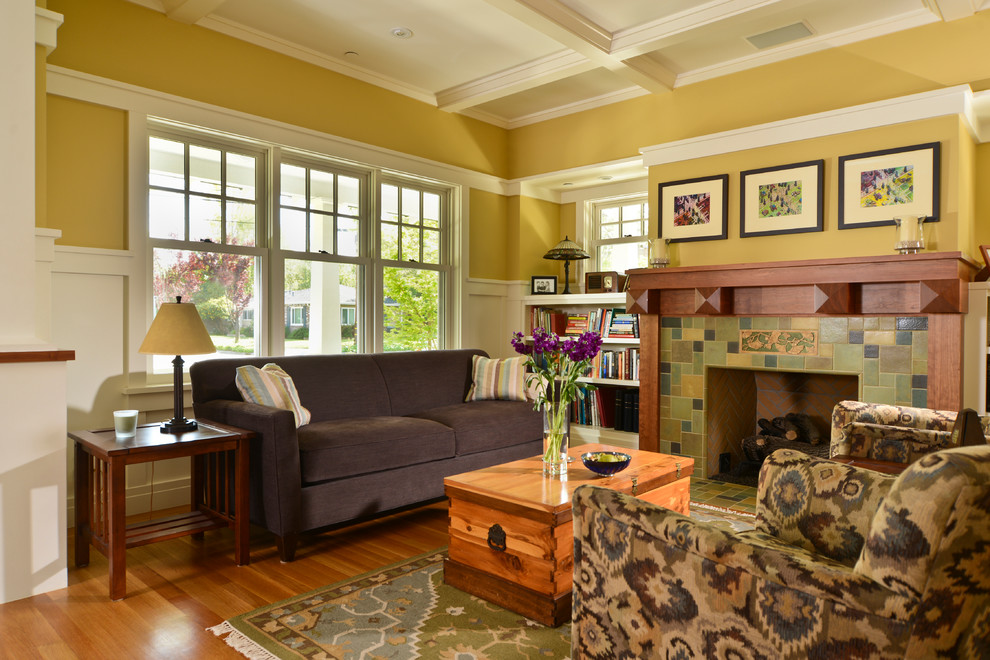 Example of an arts and crafts living room design in San Francisco with yellow walls, a standard fireplace and a tile fireplace