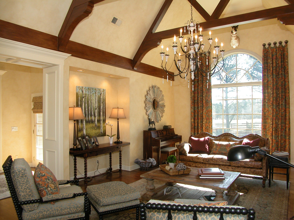 This is an example of a medium sized classic formal enclosed living room in Denver with beige walls, medium hardwood flooring, a standard fireplace, a wooden fireplace surround and no tv.