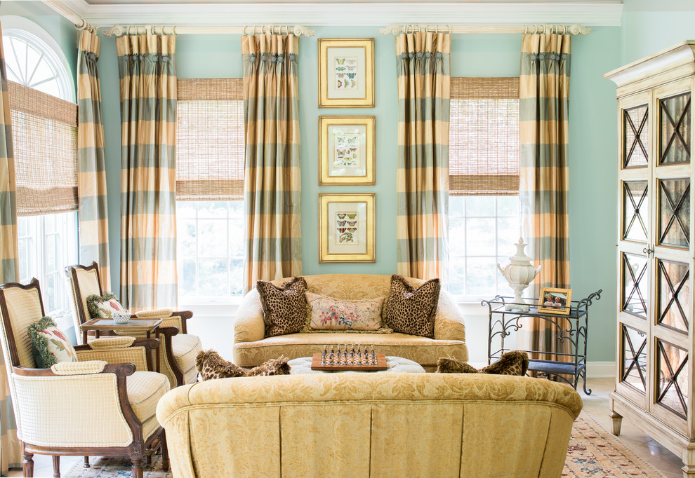 This is an example of a classic formal living room in New York with green walls.