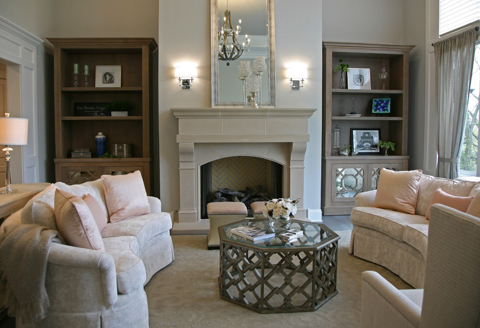 Inspiration for a large traditional formal enclosed living room in Milwaukee with grey walls, medium hardwood flooring, a standard fireplace, a stone fireplace surround, no tv and beige floors.