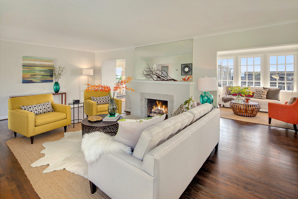 Photo of a medium sized beach style formal enclosed living room in Seattle with grey walls, dark hardwood flooring, a standard fireplace and a stone fireplace surround.