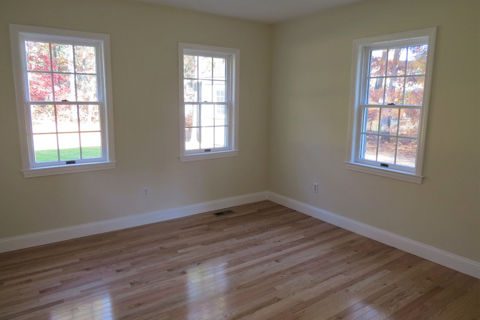 Photo of a medium sized classic living room in Boston with beige walls and medium hardwood flooring.