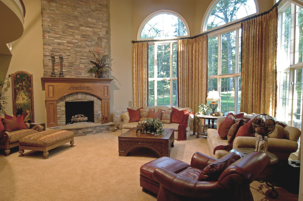 Example of a large classic formal and open concept carpeted and beige floor living room design in Dallas with beige walls, a standard fireplace and a stone fireplace