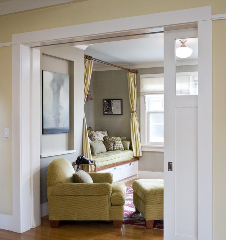Inspiration for a timeless enclosed light wood floor living room remodel in San Francisco with green walls and no fireplace