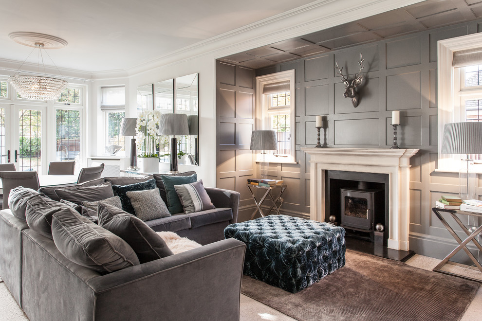 Living room - mid-sized traditional open concept and formal carpeted living room idea in Hampshire with gray walls and a wood stove
