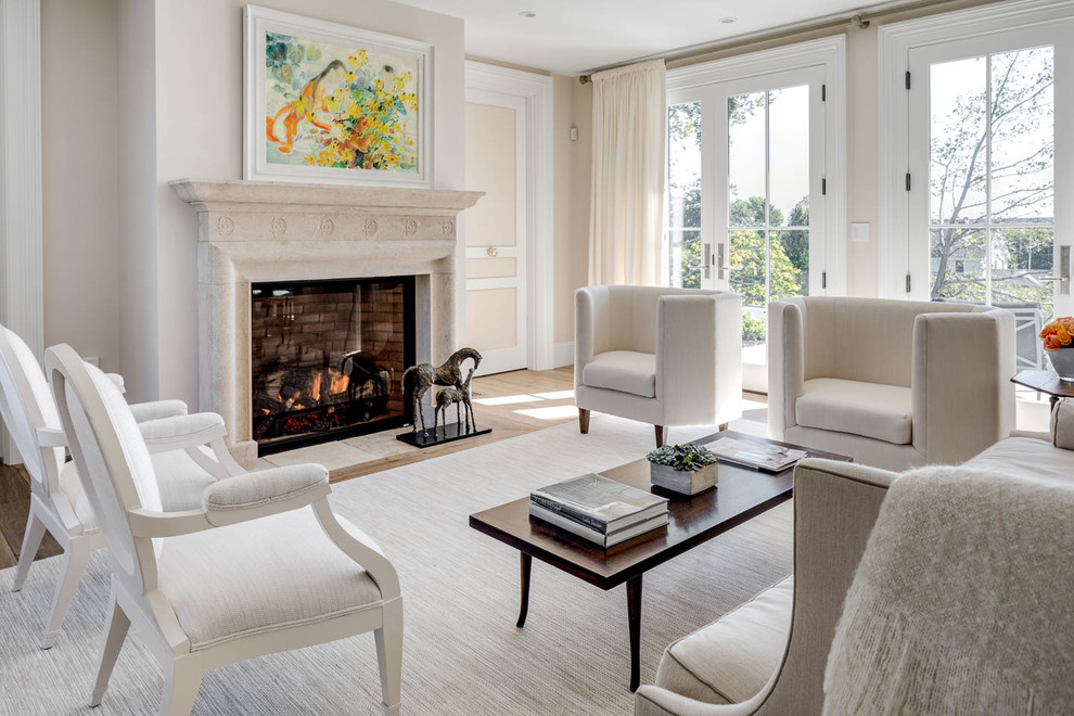 Inspiration for a large timeless formal and open concept light wood floor and brown floor living room remodel in Boston with a standard fireplace, a stone fireplace and beige walls