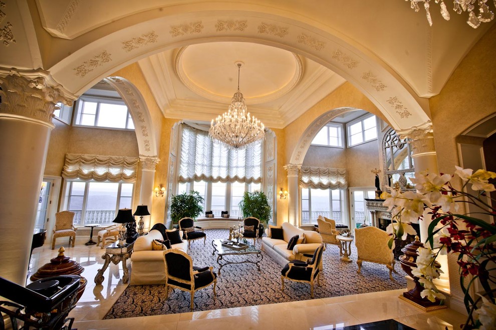 Huge elegant living room photo in San Diego with beige walls