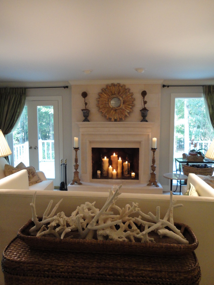 Mid-sized elegant enclosed living room photo in Raleigh with gray walls, a standard fireplace and a stone fireplace
