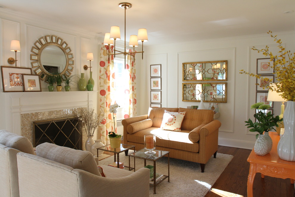На фото: гостиная комната в классическом стиле с фасадом камина из плитки с