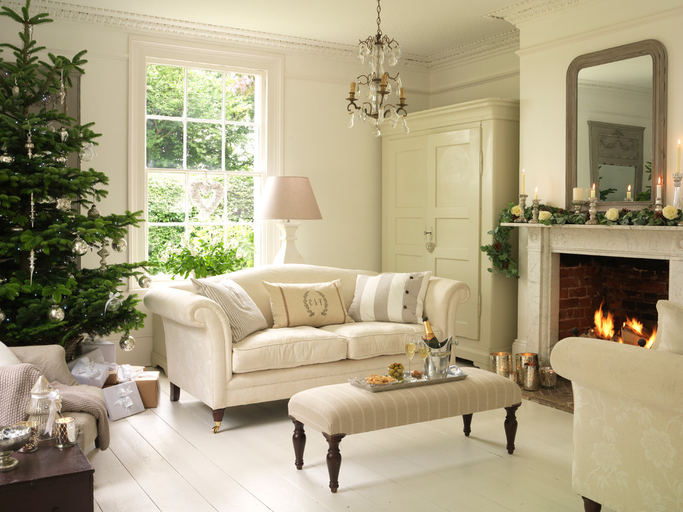 Photo of a traditional formal enclosed living room in Essex with white walls, painted wood flooring, a standard fireplace, a stone fireplace surround and no tv.