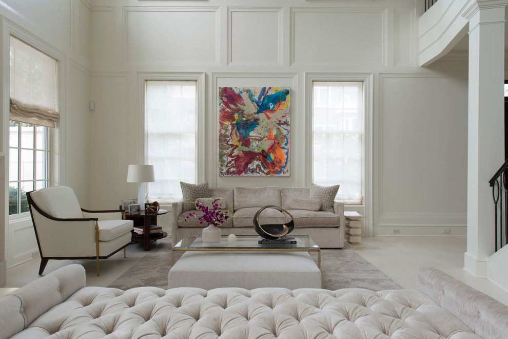 This is an example of a large classic formal open plan living room in DC Metro with white walls and limestone flooring.