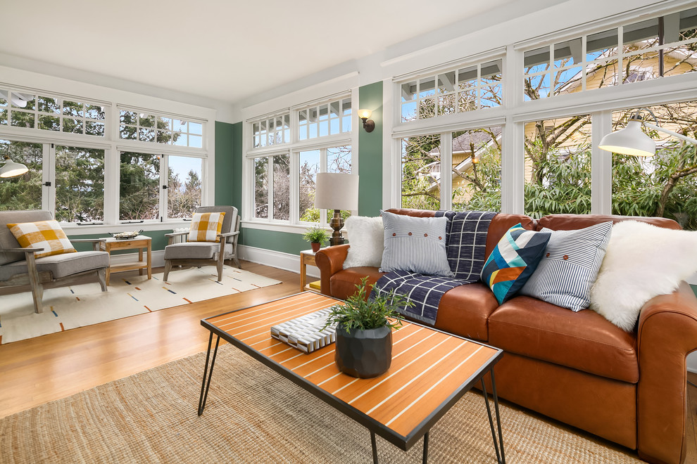 Elegant light wood floor living room photo in Seattle with green walls