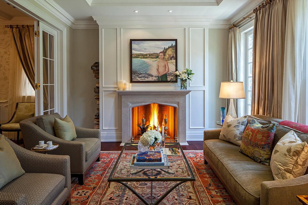Inspiration for a traditional living room in Toronto with dark hardwood flooring and a standard fireplace.