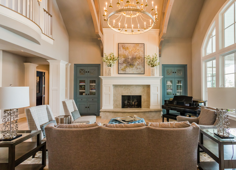 Idée de décoration pour un salon tradition ouvert avec une salle de musique, un mur beige, parquet clair, une cheminée standard et aucun téléviseur.