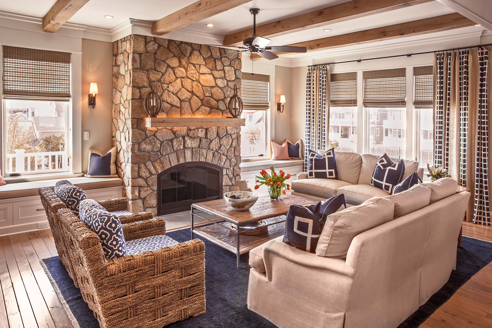 Mid-sized elegant open concept and formal medium tone wood floor living room photo in New York with beige walls, a standard fireplace, a stone fireplace and no tv